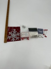 A collection of assorted Christmas-themed craft supplies and decorative items.