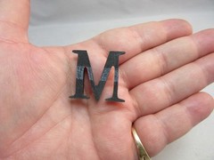 13 black plastic letters. Random mix